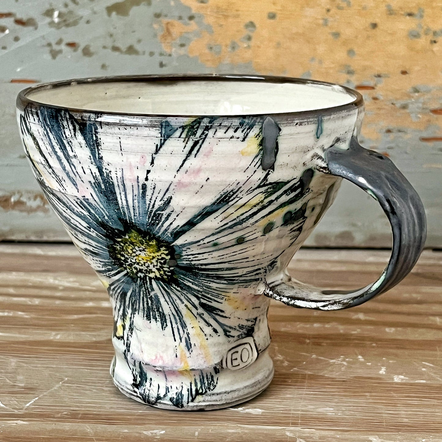 Handmade ceramic mug with flowers
