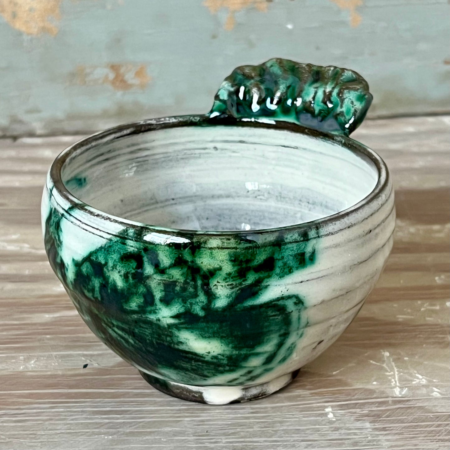 handmade ceramic bowl with handle, white with green prints