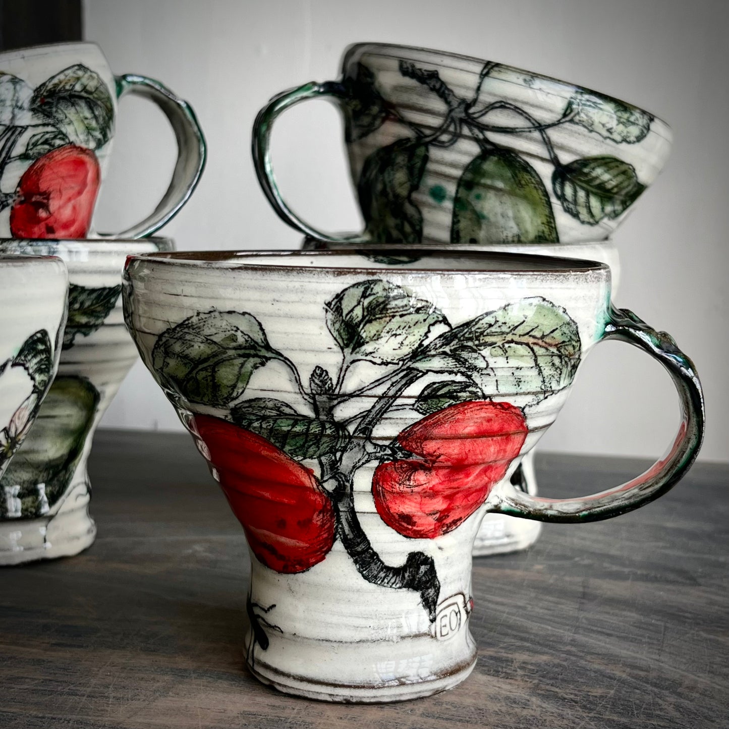 handmade ceramic mugs, decorated with apples and pears