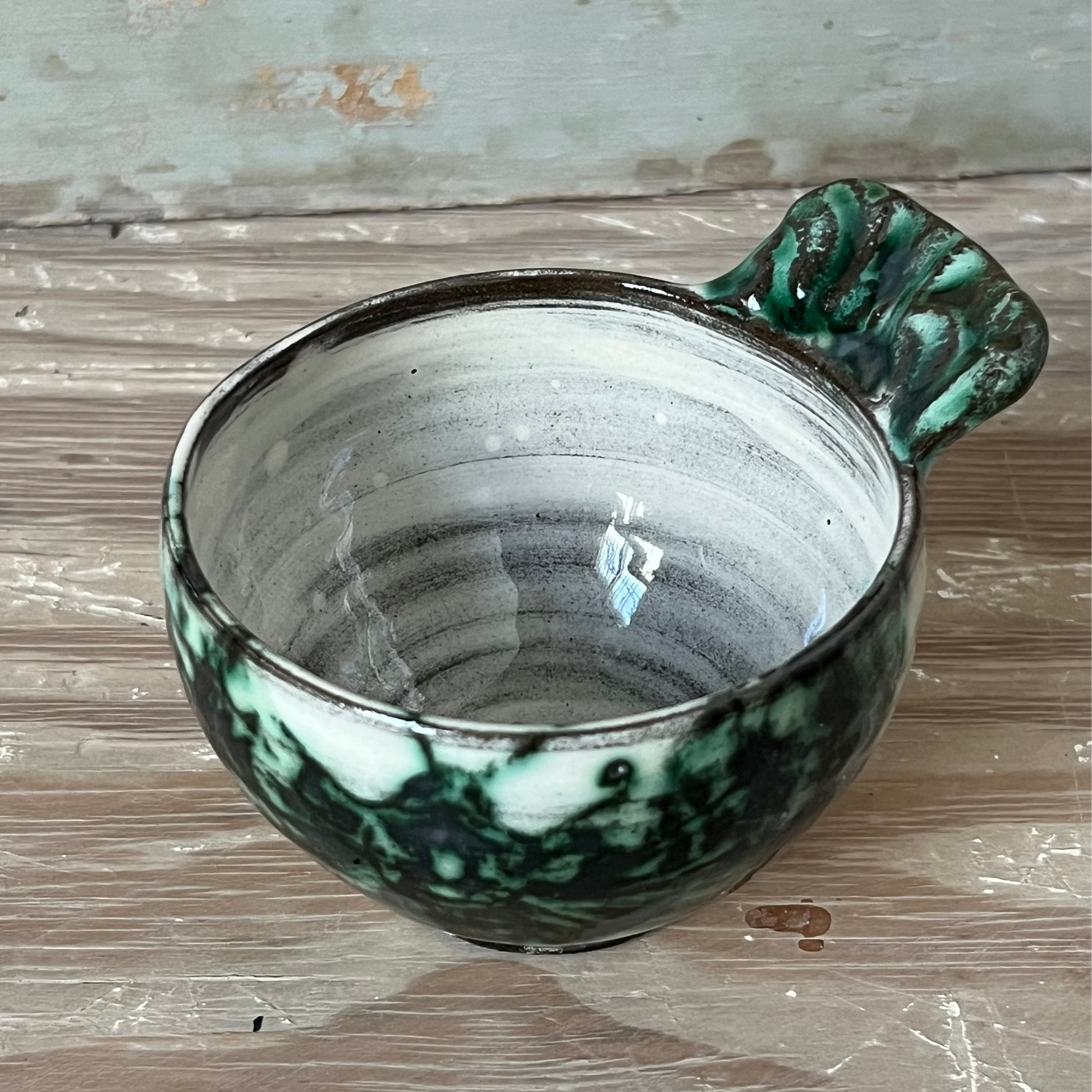 handmade ceramic bowl with handle, white and green