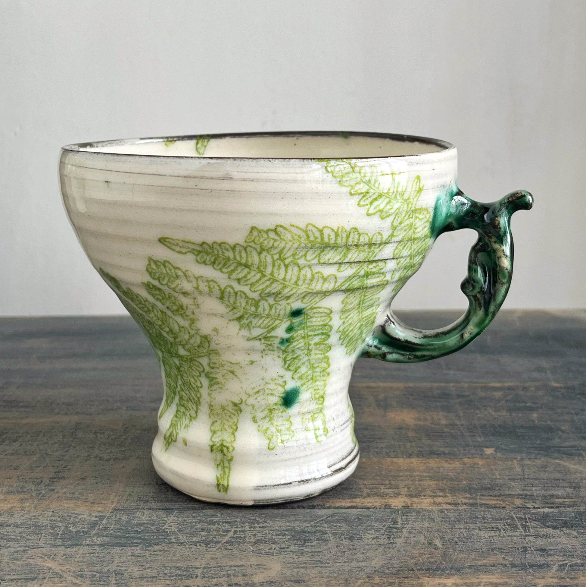 Handmade ceramic mug, white with green motif 