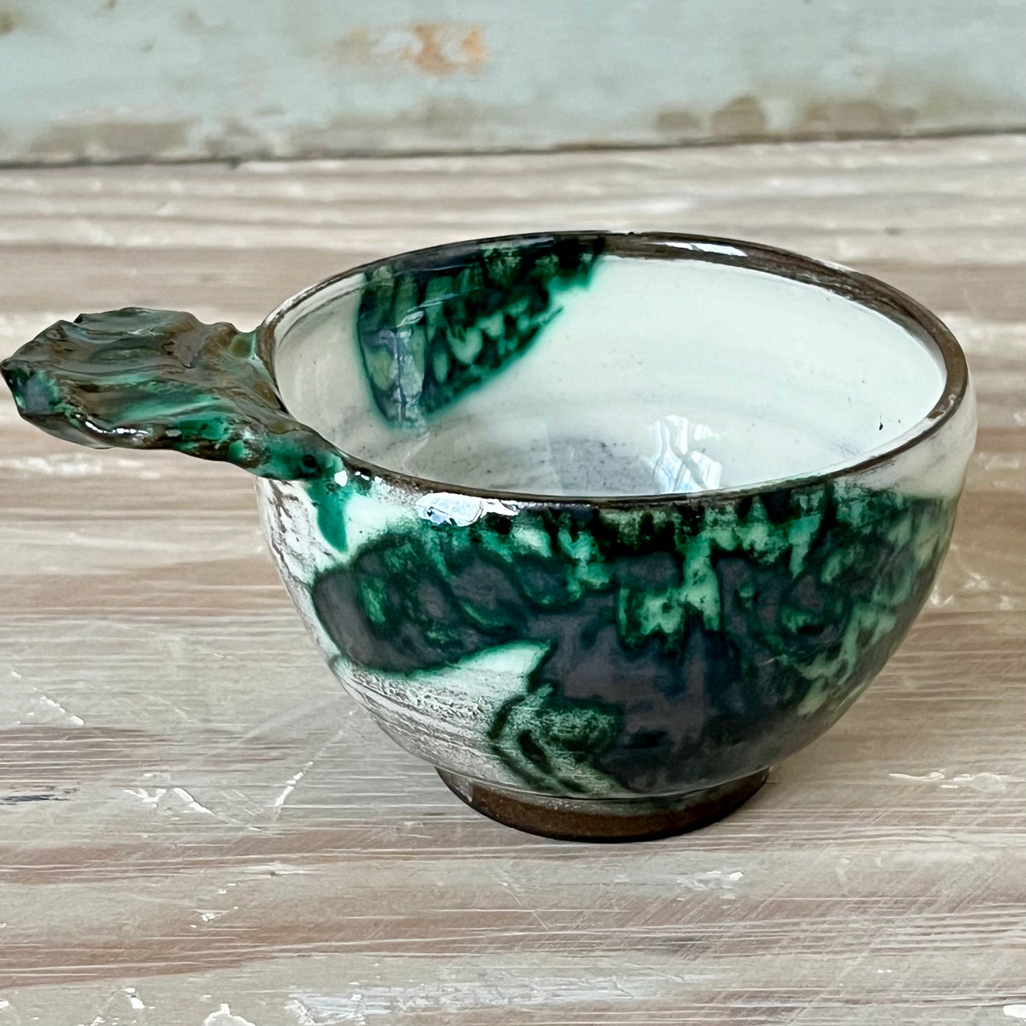 handmade ceramic bowl with handle, white with green prints